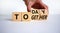 Today we are together symbol. Businessman turns wooden cubes and changes the word together to today. Beautiful white background,