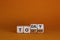 Today we are together symbol. Turned wooden cubes and changed the word together to today. Beautiful orange background, copy space