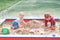 Toddler activity on playground in sandbox
