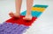 Toddler on baby foot massage mat. Exercises for legs on orthopedic massage carpet. prevention of flat feet and hallux