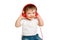 Toddler baby listens to music in red headphones on a studio isolated o