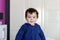 Toddler with blue zippered sweatshirt