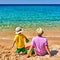 Toddler boy on beach with father