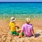 Toddler boy on beach with father