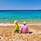 Toddler boy on beach with father