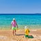 Toddler boy on beach with father