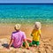 Toddler boy on beach with father