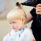 Toddler boy getting his first hairstyle
