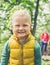 Toddler boy hiking with mother