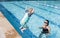 Toddler Boy Jumps into Pool with Mother Waiting to Catch Him