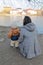 Toddler boy with mom standing by river