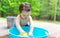 Toddler boy playing in a little bath tub