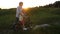 Toddler boy riding bicycle with grandmother`s help