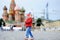 Toddler boy running with russian flag