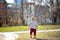 Toddler boy walking at the warm spring day