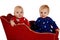 Toddler boys in Christmas pajamas happy