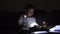 toddler caucasian girl reading book at hight with flashlight. Unplugged childhood activities. goodnight bedtime routine