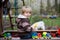 Toddler child, boy, playing in sandpit at backyard