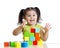 Toddler child playing wooden toy blocks isolated