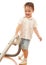 Toddler is cleaning room with vacuum cleaner