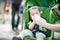 Toddler drinking water stitting in pram outdoors