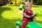 Toddler driving toy car outdoors