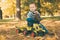 Toddler driving a toy truck in park