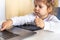 Toddler drowing on drawing board