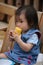 Toddler eating corn on the cob