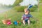 Toddler eggs hunters close-up. Children activity for Easter in nature