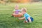 Toddler eggs hunters close-up. Children activity for Easter in nature