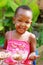 A toddler enjoying ice-cream on a sunny afternoon