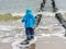 Toddler enjoys the waves baltic sea