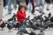 Toddler feeding the pigeons