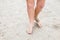 Toddler feet on sand at the beach