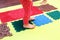 Toddler with a flat-bottomed stomach goes barefoot on an orthopedic foot mat for the appointment of an orthopedist. gymnastics for