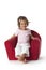 Toddler girl in an armchair