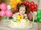 Toddler girl with birthday cake