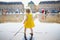 Toddler girl having fun famous outdoor water fountain Miroir d`eau in Bordeaux