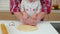 Toddler girl and her father cutting out cookies together