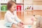 Toddler girl playing with her stuffed animals