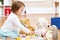 Toddler girl playing with her stuffed animals