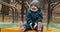 Toddler girl playing outside in a Toronto park on a winter day.