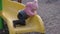 Toddler girl slides down the helical children\'s slide at local playground