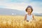 Toddler girl in the wheat field