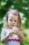 Toddler girl with white Taraxacum officinale or