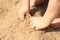 Toddler hands in sand