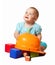 Toddler with hardhat and toy blocks