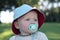 Toddler in hat with pacifier