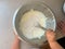 Toddler Helping Parents To Mix Batter